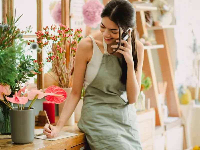 Woman reading a message from a local business on her phone