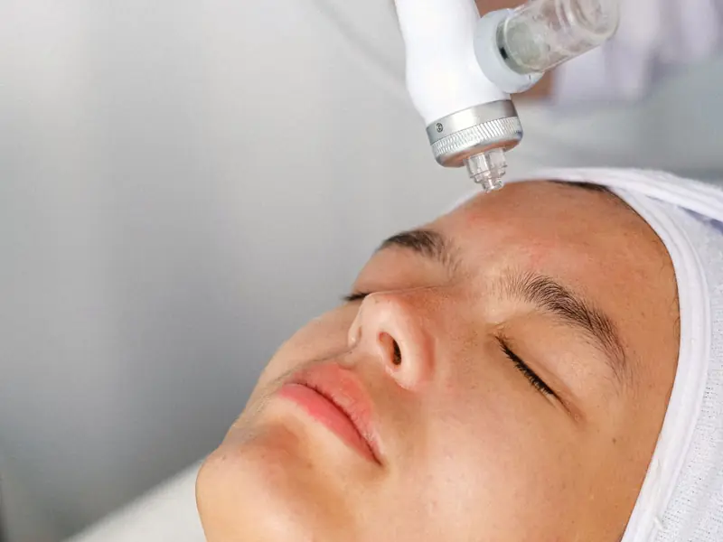 Client receiving a facial treatment at a spa