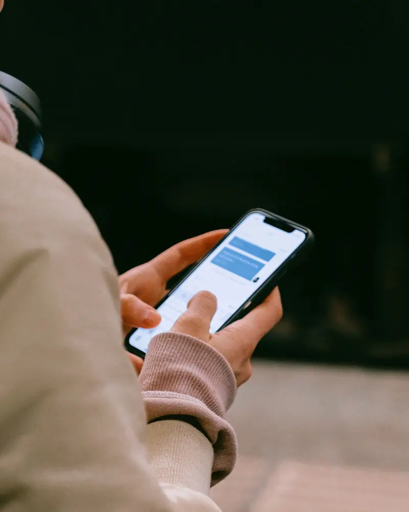 Customer texting a local business on her phone